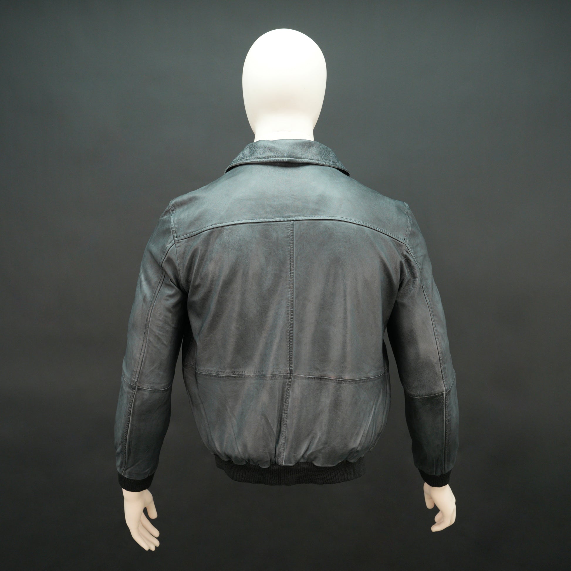 Men’s black leather jacket with zip closure, two side pockets, one left arm pocket, and one inside pocket, combining style and everyday functionality