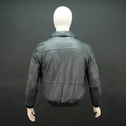 Men’s black leather jacket with zip closure, two side pockets, one left arm pocket, and one inside pocket, combining style and everyday functionality