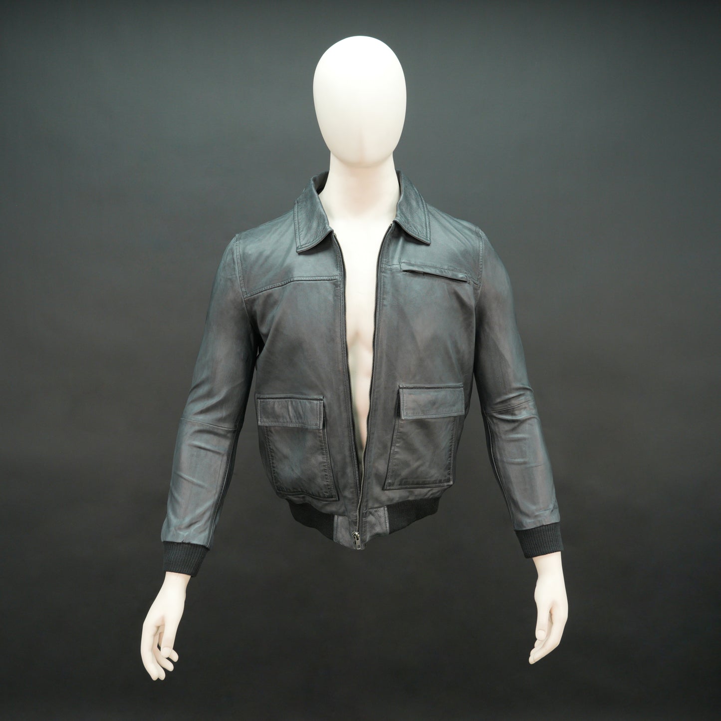 Men’s black leather jacket with zip closure, two side pockets, one left arm pocket, and one inside pocket, combining style and everyday functionality