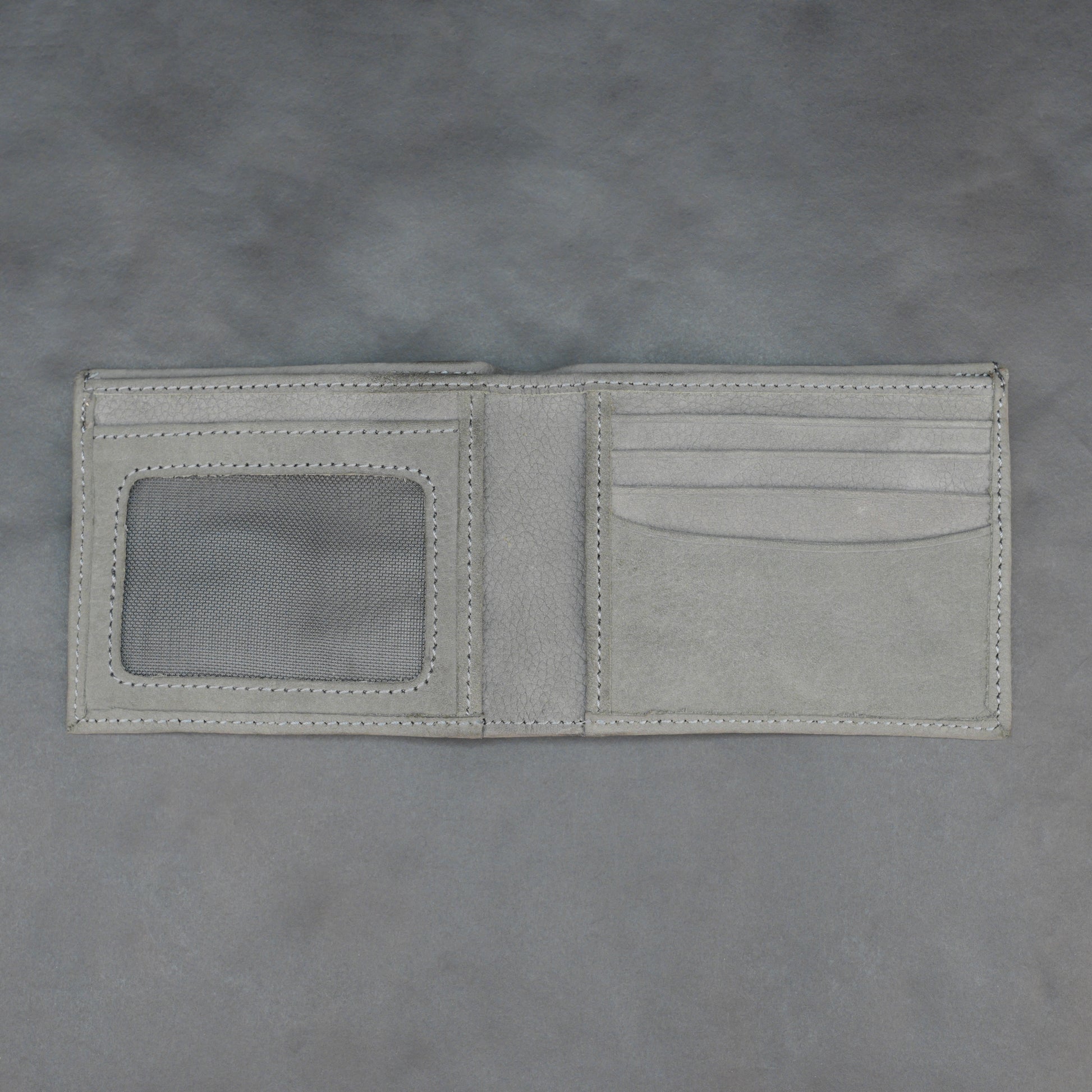 Grey leather wallet with 10 card slots and 2 cash compartments, sleek, slim, and durable for everyday use