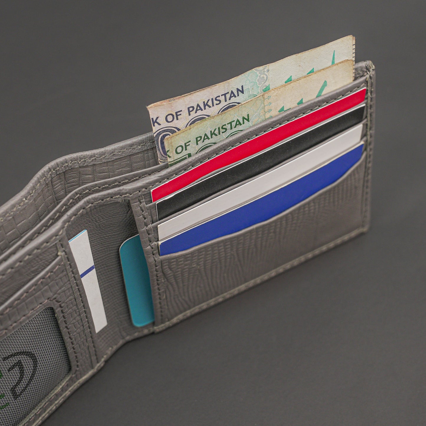 Premium grey leather wallet, sleek and compact holds 6 cards, 1 ID, and 2 cash compartments for everyday use.