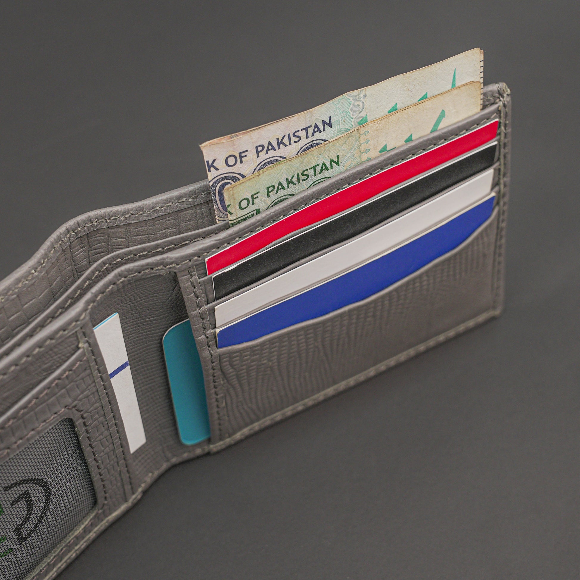 Premium grey leather wallet, sleek and compact holds 6 cards, 1 ID, and 2 cash compartments for everyday use.