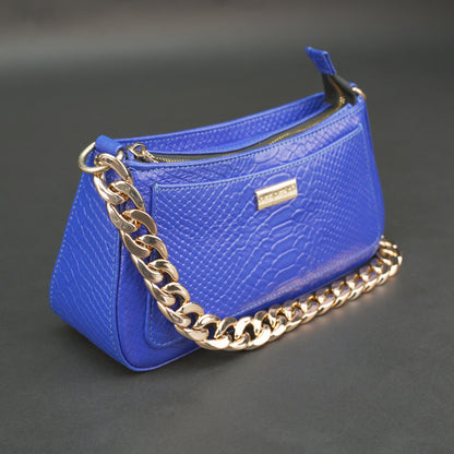 Real leather handbag with gold chain and zipper compartment.