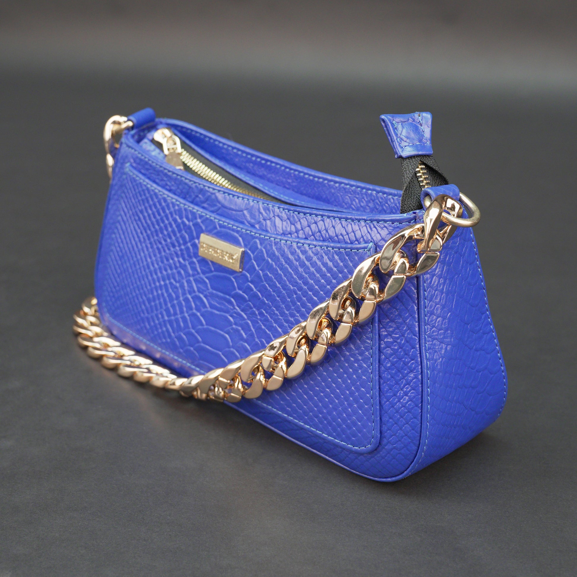 Real leather handbag with gold chain, spacious compartment, zipper pocket, outer pocket, available in multiple colors for daily use