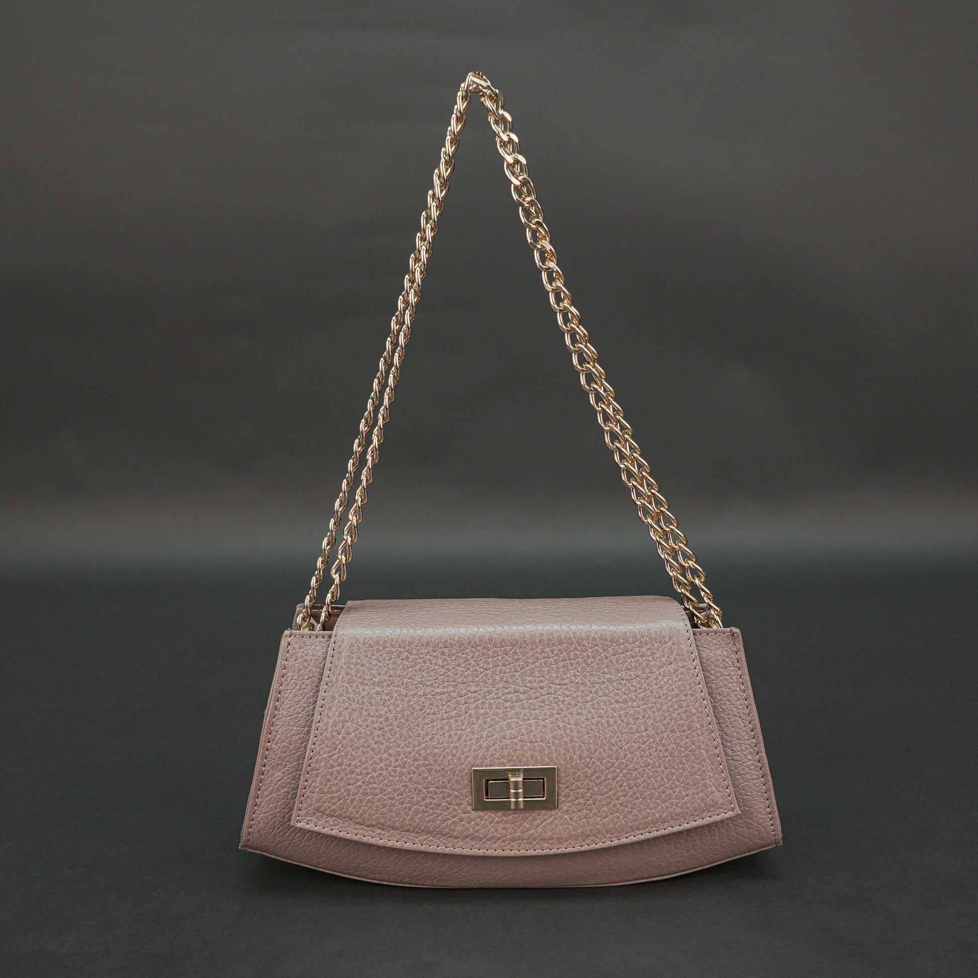 Brown real leather handbag with brass chain and zip compartment.