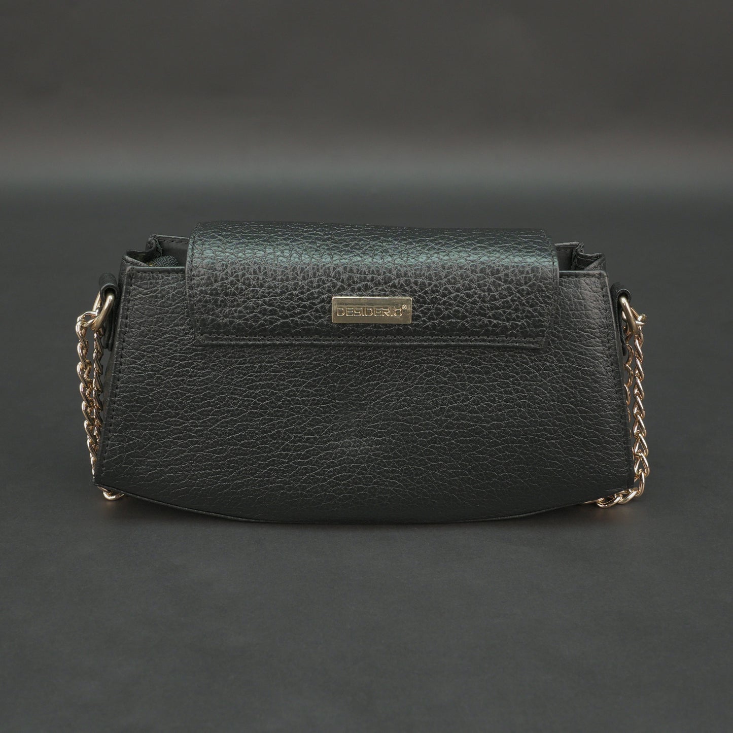 Black real leather handbag with brass chain and zip compartment.