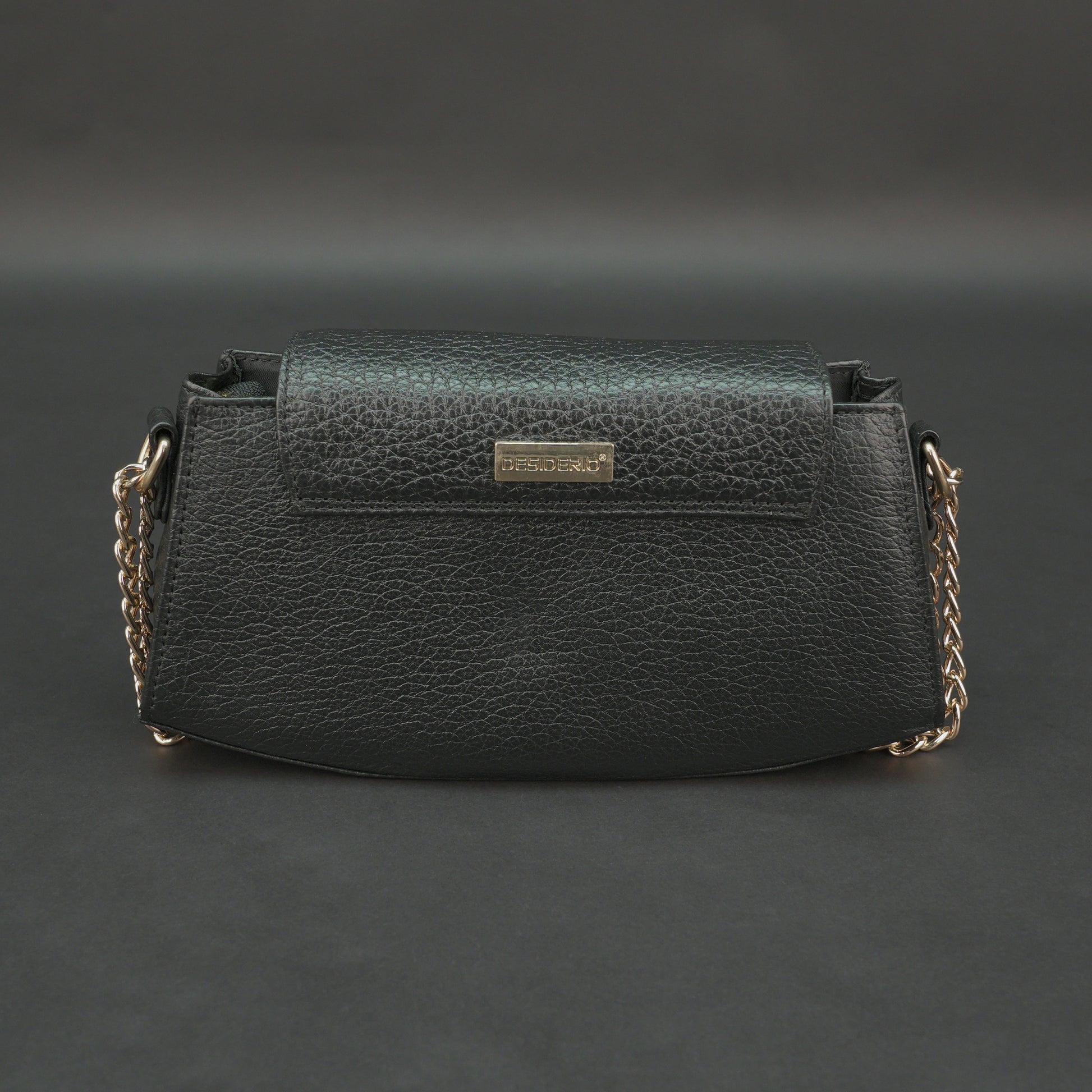 Black real leather handbag with brass chain and zip compartment.