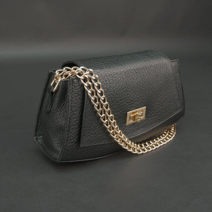 Black real leather handbag with brass chain and zip compartment.
