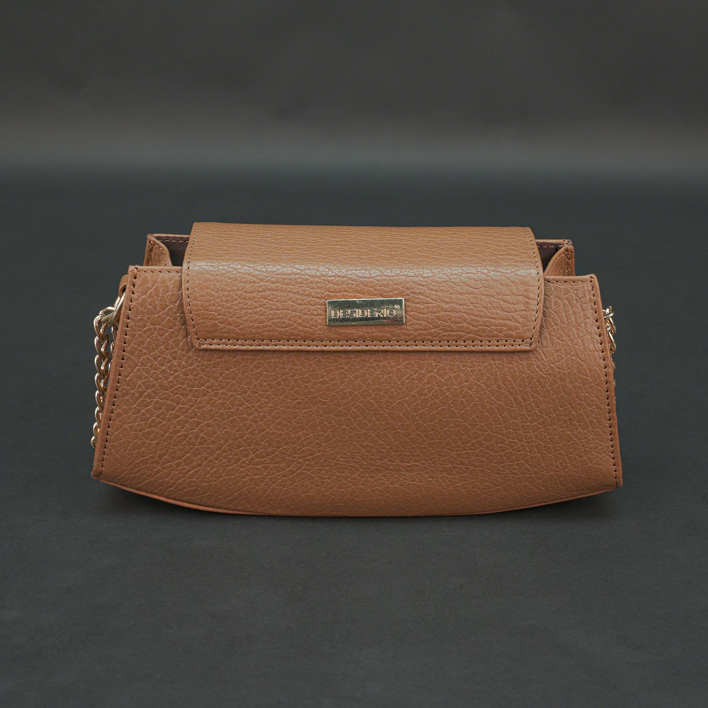 Tan leather handbag with chain and zipper.
