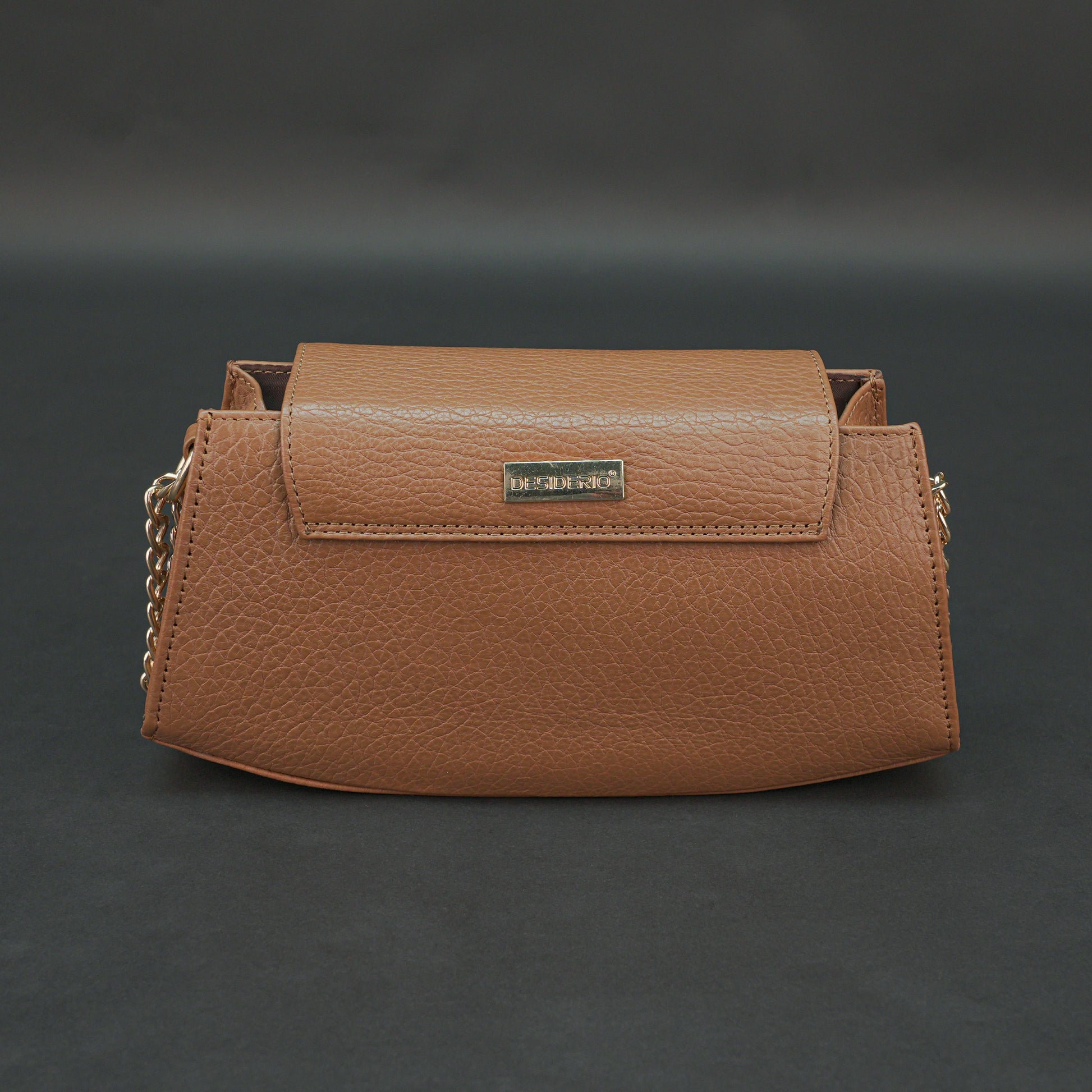 Tan leather handbag with chain and zipper.
