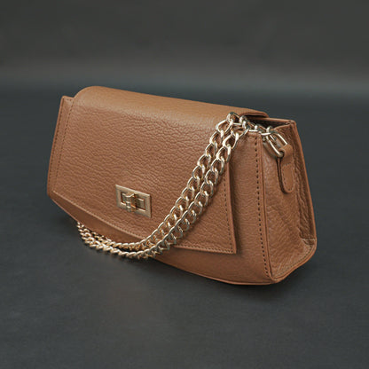 Tan leather handbag with chain and zipper.