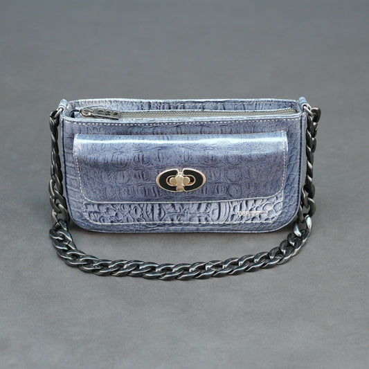 Blue croco leather handbag with zipper compartment and metal chain.