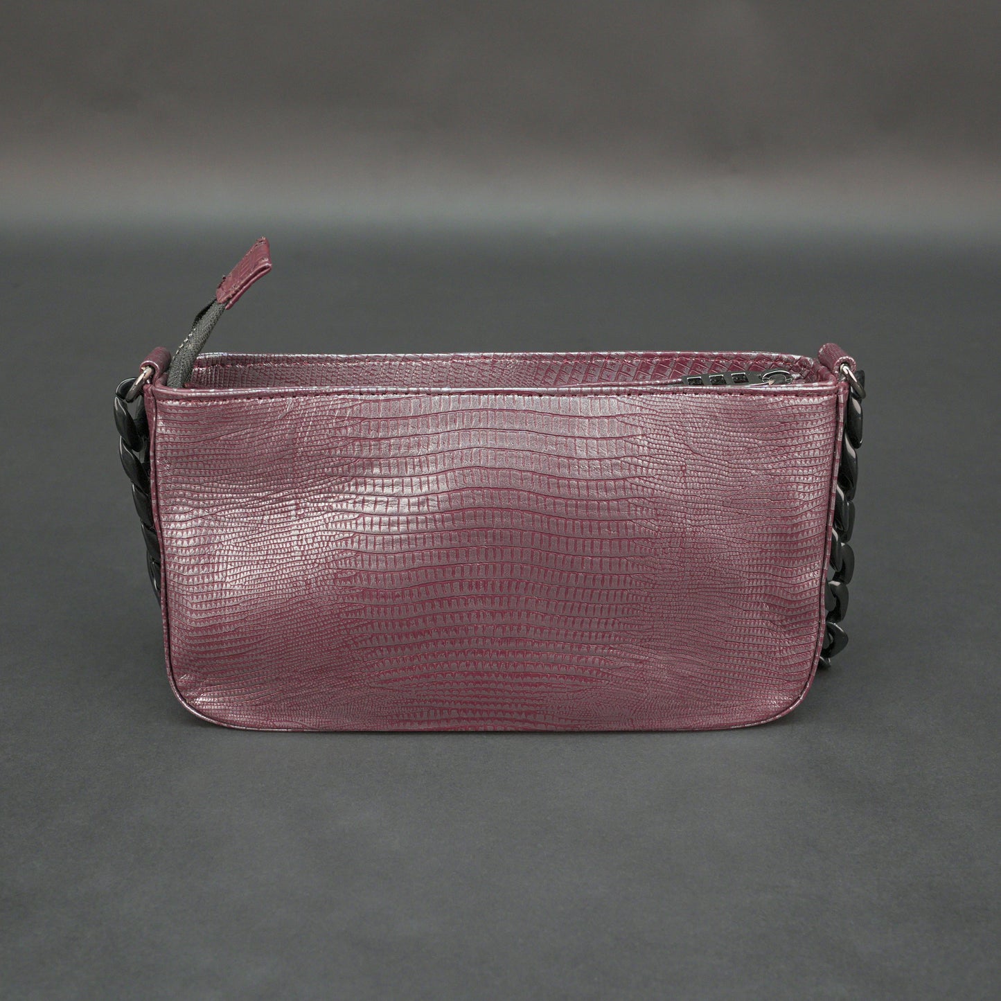 Maroon leather handbag with chain and pocket.