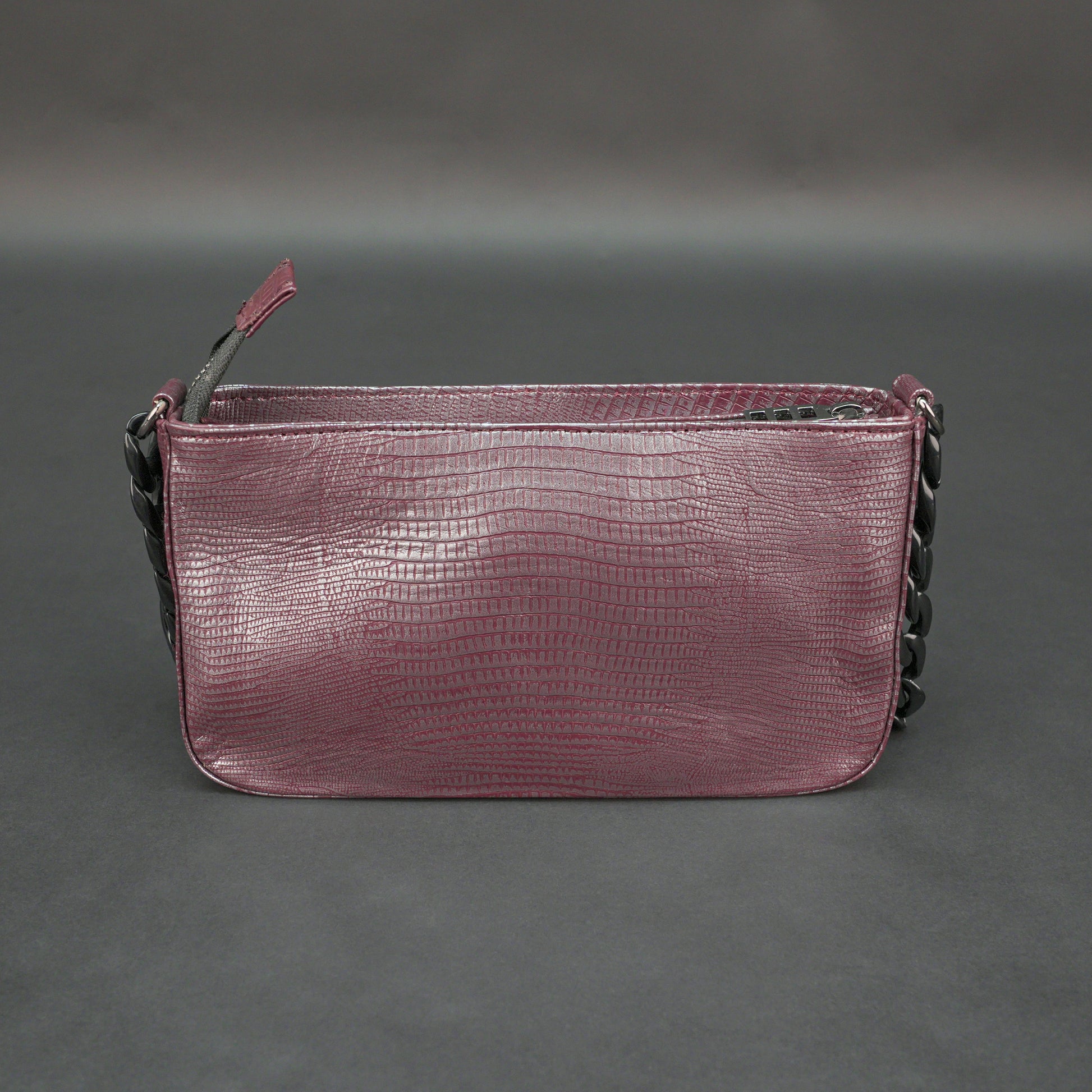 Maroon leather handbag with chain and pocket.