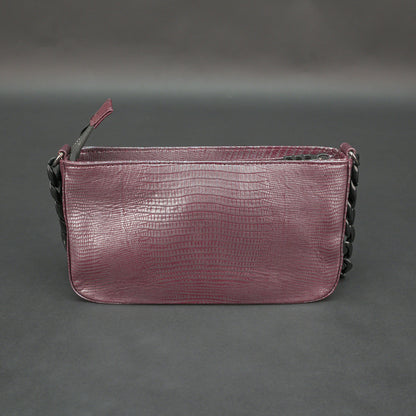 Maroon leather handbag with chain and pocket.