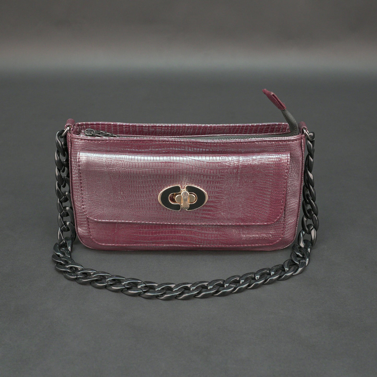Maroon leather handbag with chain and pocket.
