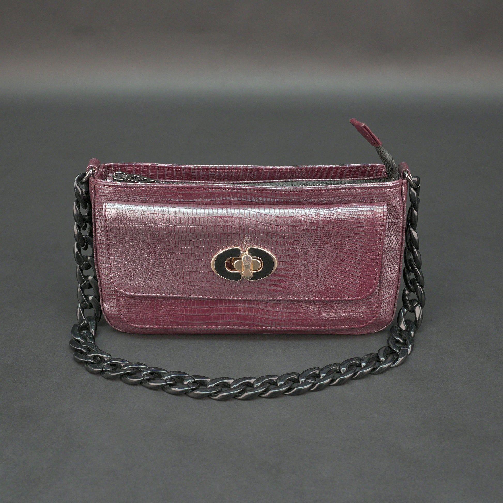 Maroon leather handbag with chain and pocket.