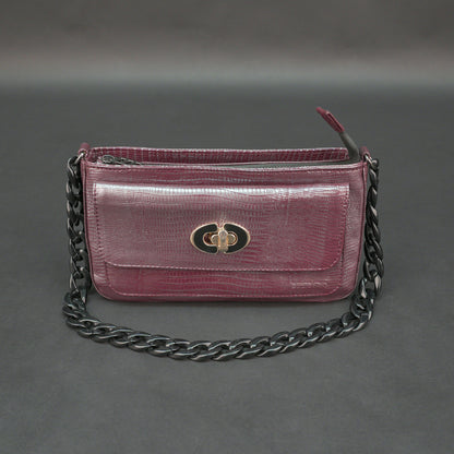 Maroon leather handbag with chain and pocket.