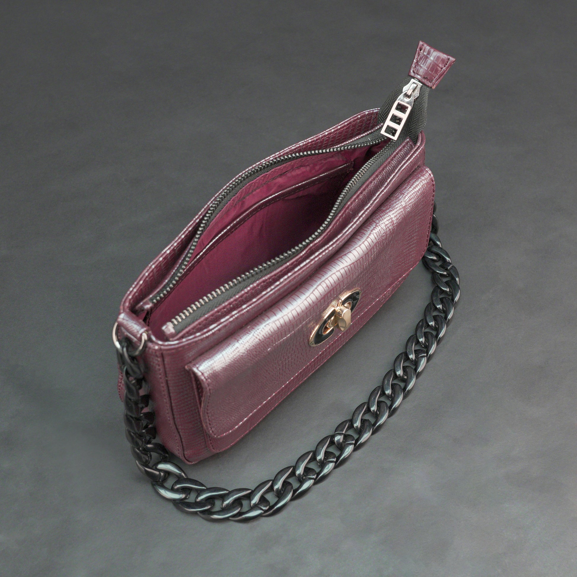 Real leather maroon handbag with metal chain, zipper main compartment, outer pocket, shoulder strap, stylish daily use bag