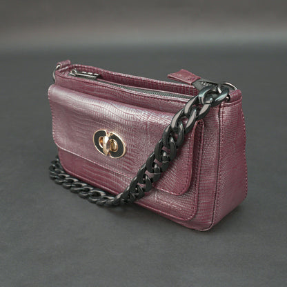 Maroon leather handbag with chain and pocket.