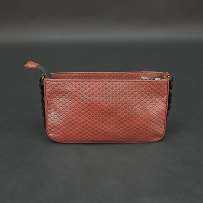 Brown leather handbag with metal chain and zipper compartment.