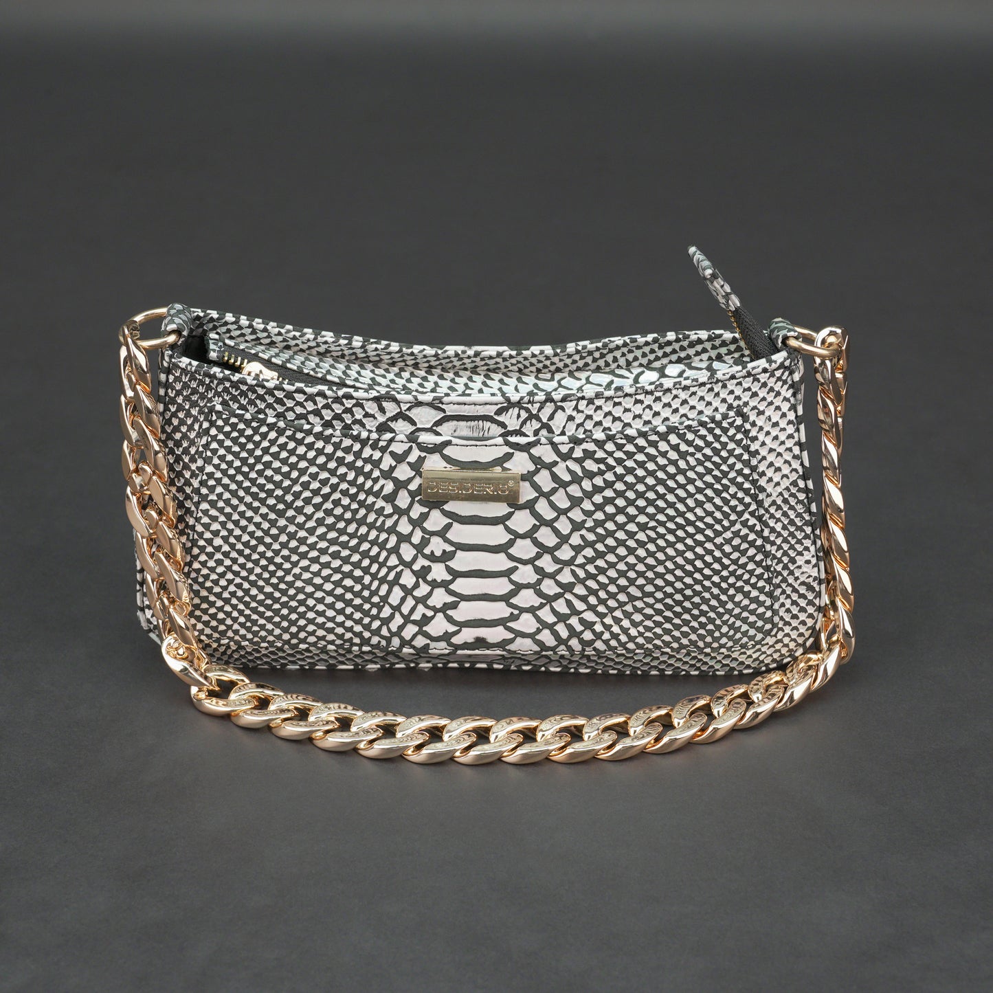 Real leather handbag with gold chain and zipper compartment.