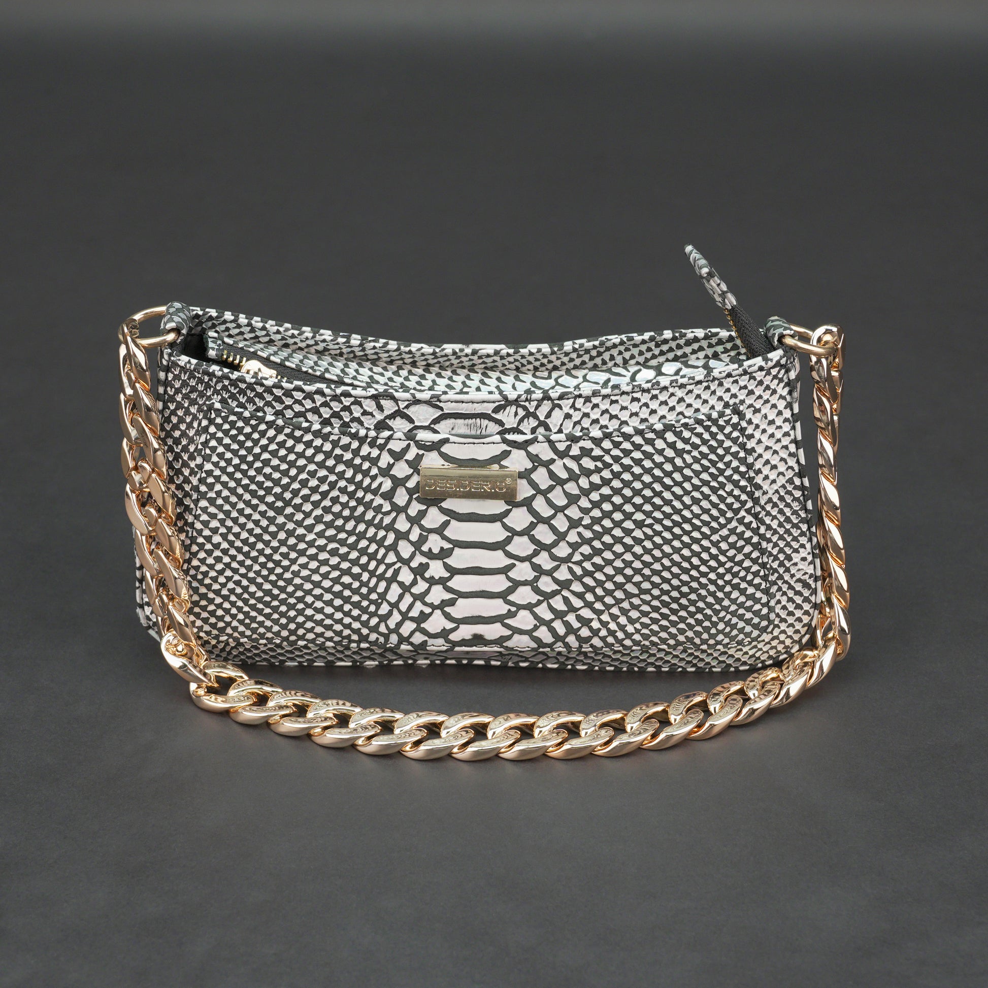 Real leather handbag with gold chain and zipper compartment.