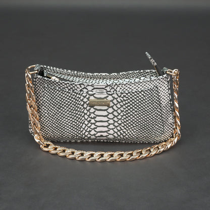Real leather handbag with gold chain and zipper compartment.