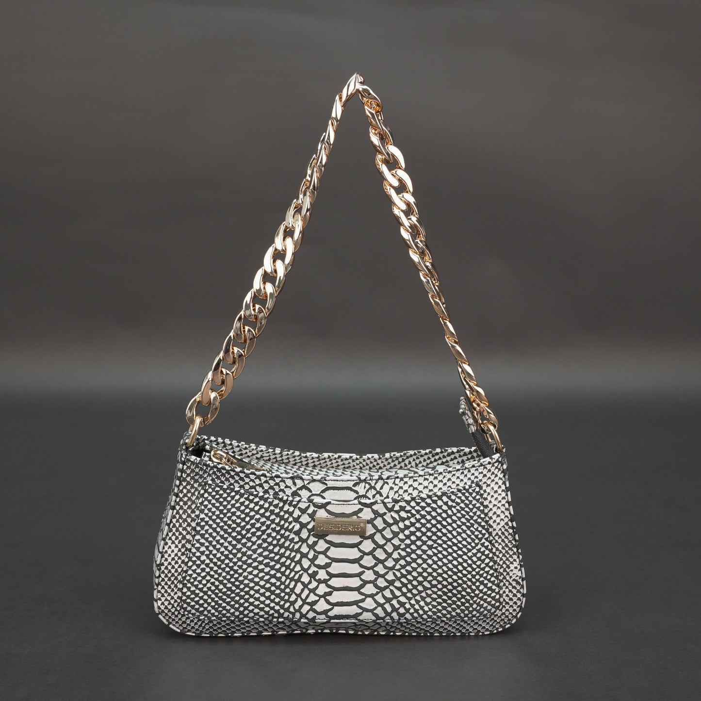 Real leather handbag with gold chain and zipper compartment.