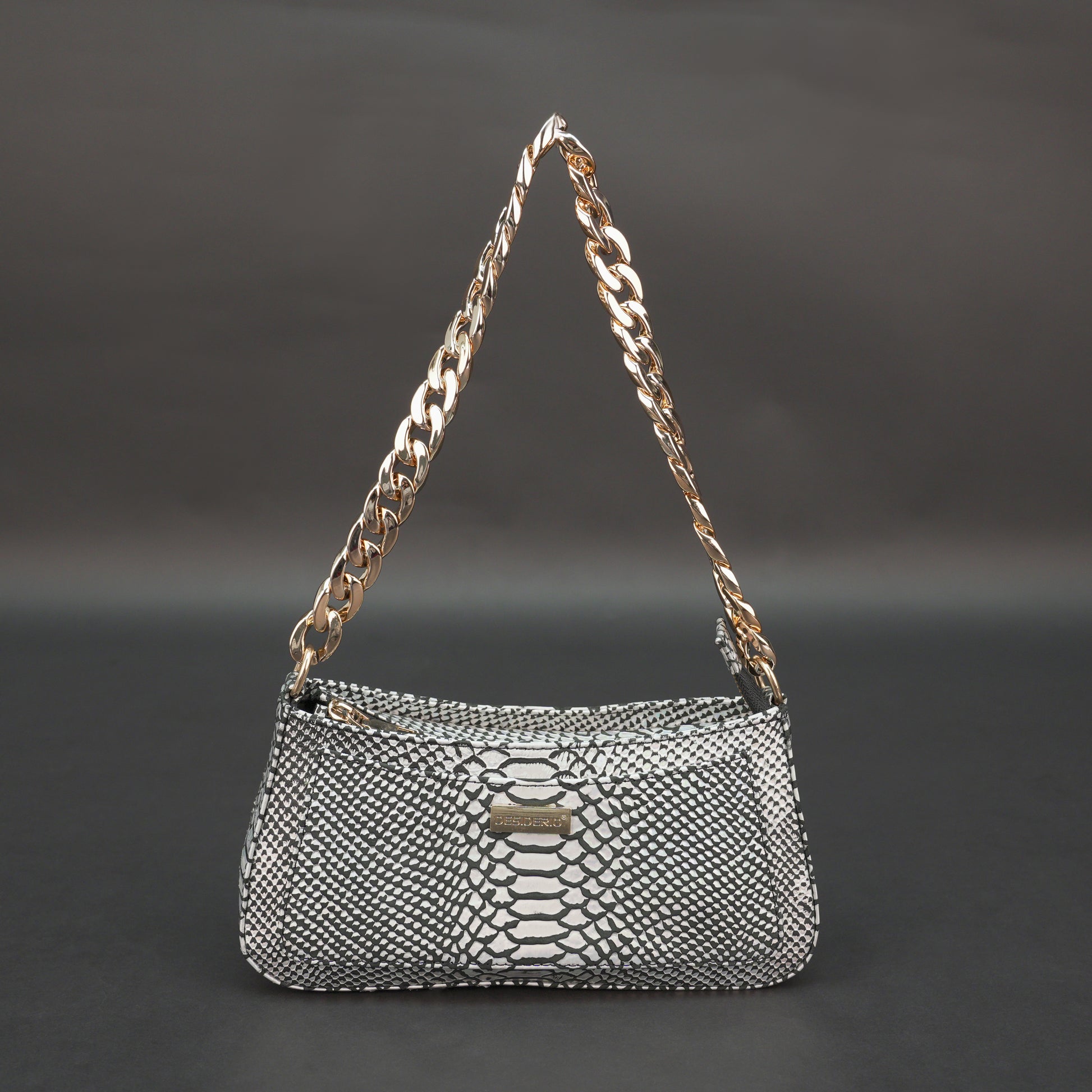 Real leather handbag with gold chain and zipper compartment.