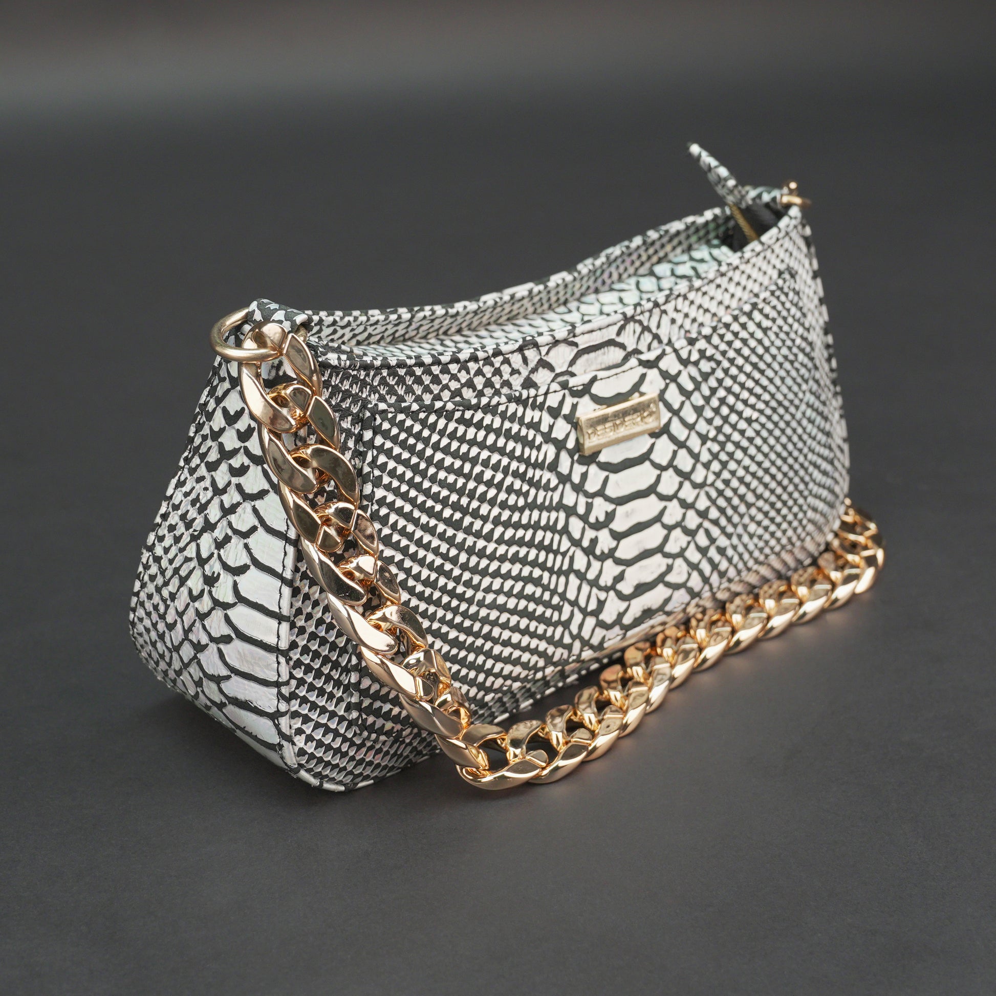 Real leather handbag with gold chain and zipper compartment.