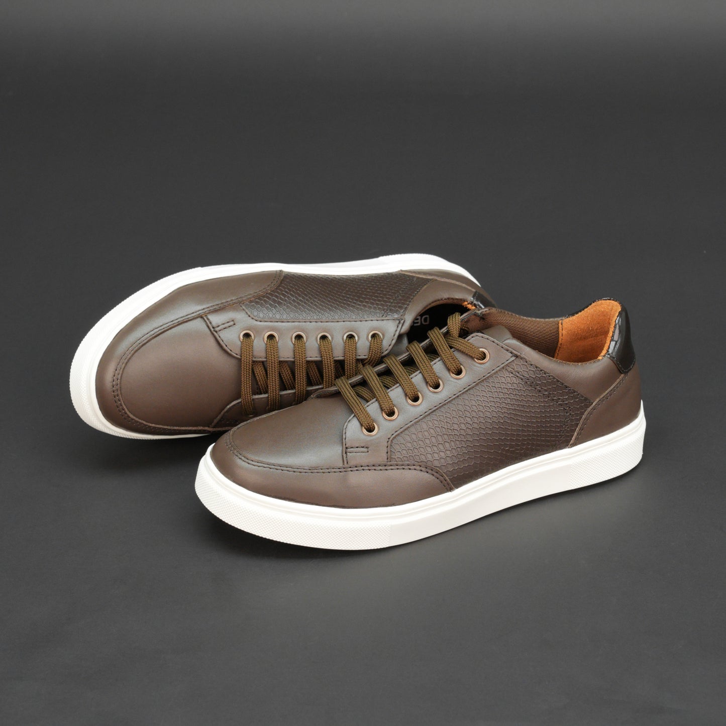 Brown tri-tone cow leather sneakers with breathable mesh lining and flexible TPR sole.