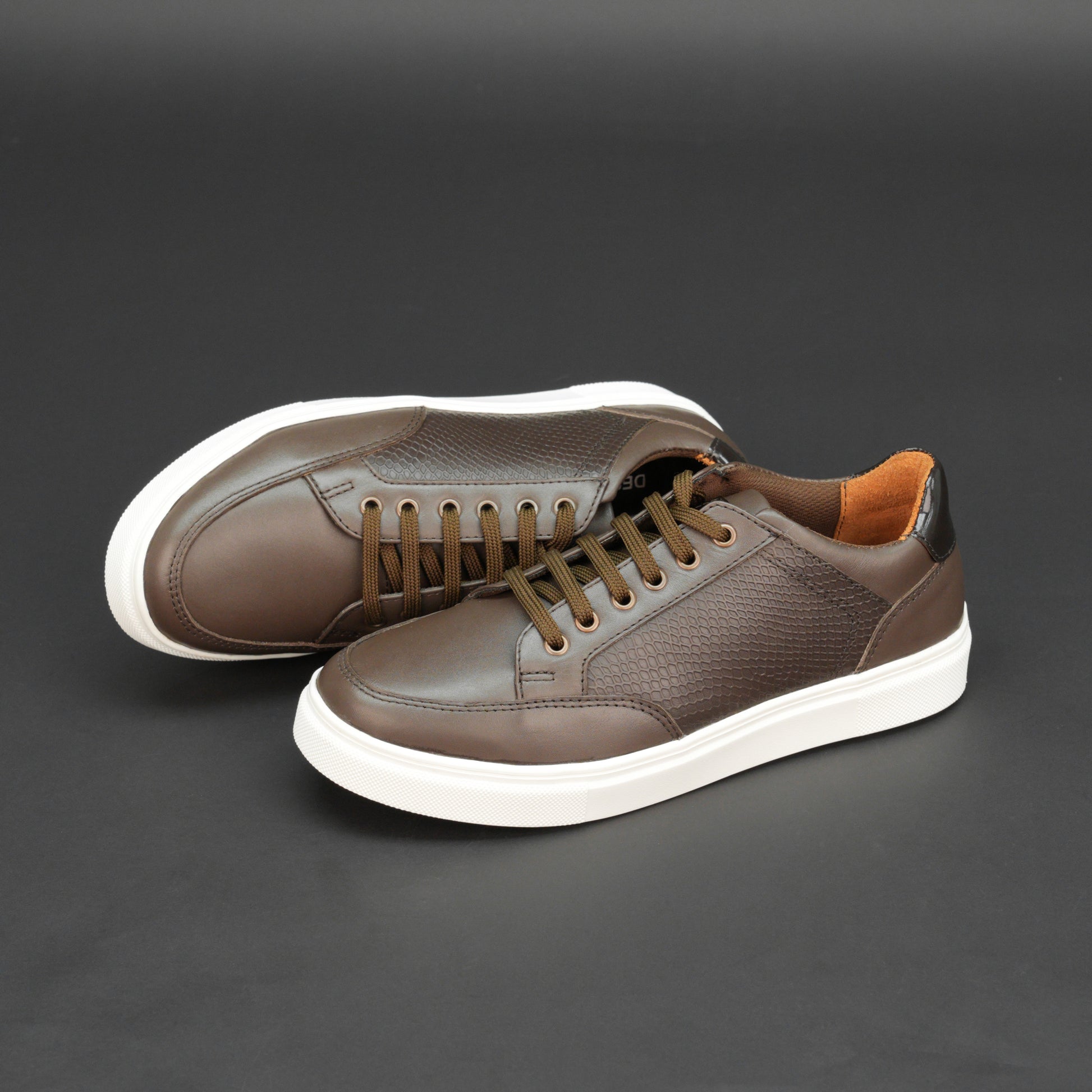 Brown tri-tone cow leather sneakers with breathable mesh lining and flexible TPR sole.