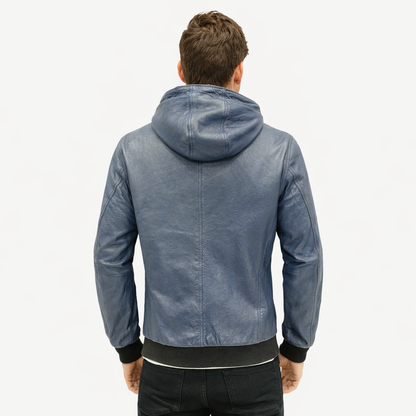 Men’s blue hooded leather jacket made from tumble-washed sheep leather in pastel brown, featuring front zip closure, two exterior pockets, a secure side zip pocket, and a soft, luxurious finish