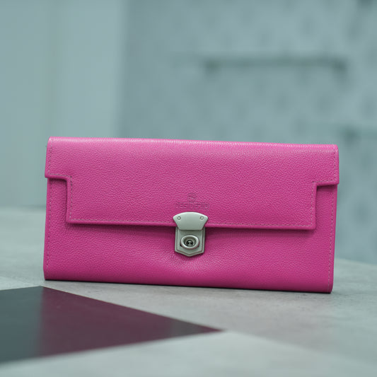 Charming pink real leather clutch with 3 compartments, 16 card slots, a zip pocket, cash compartment, and security key for peace of mind.