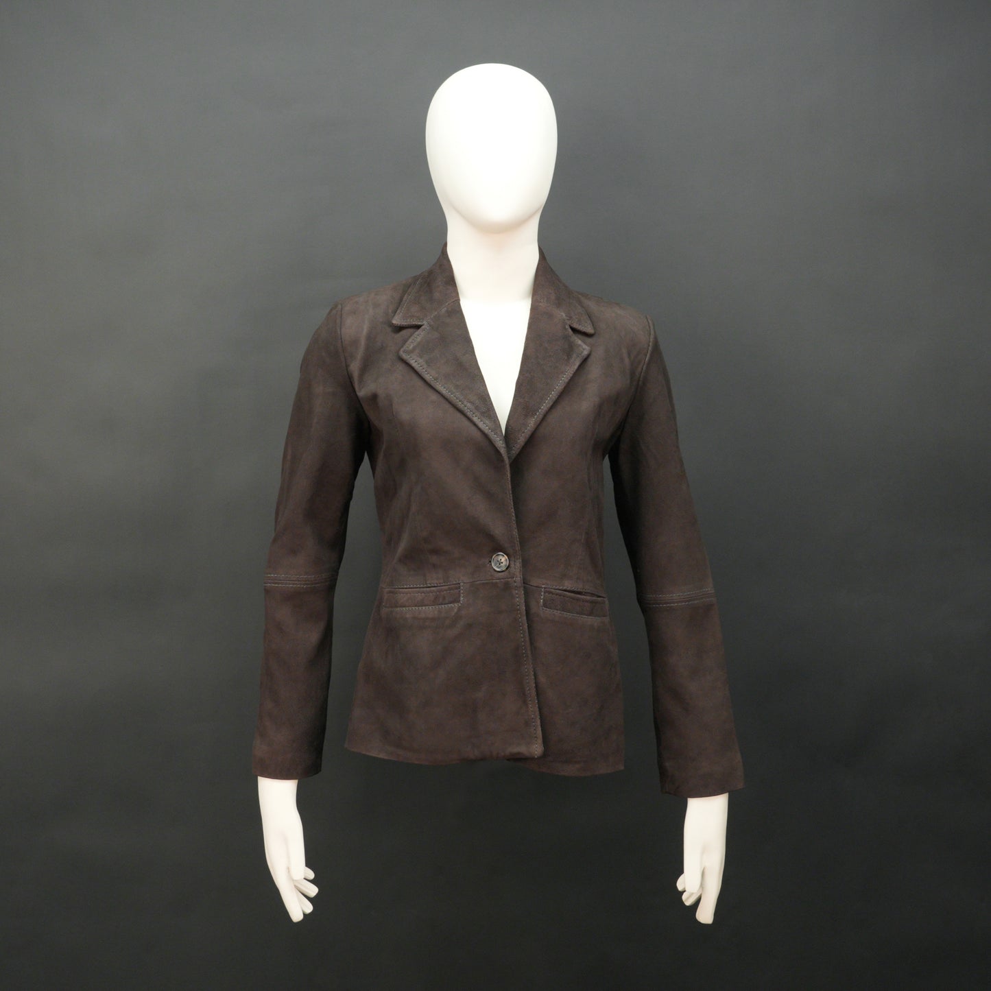 Dark brown goat leather coat with soft, durable material, two functional pockets, and versatile design for casual and formal wear