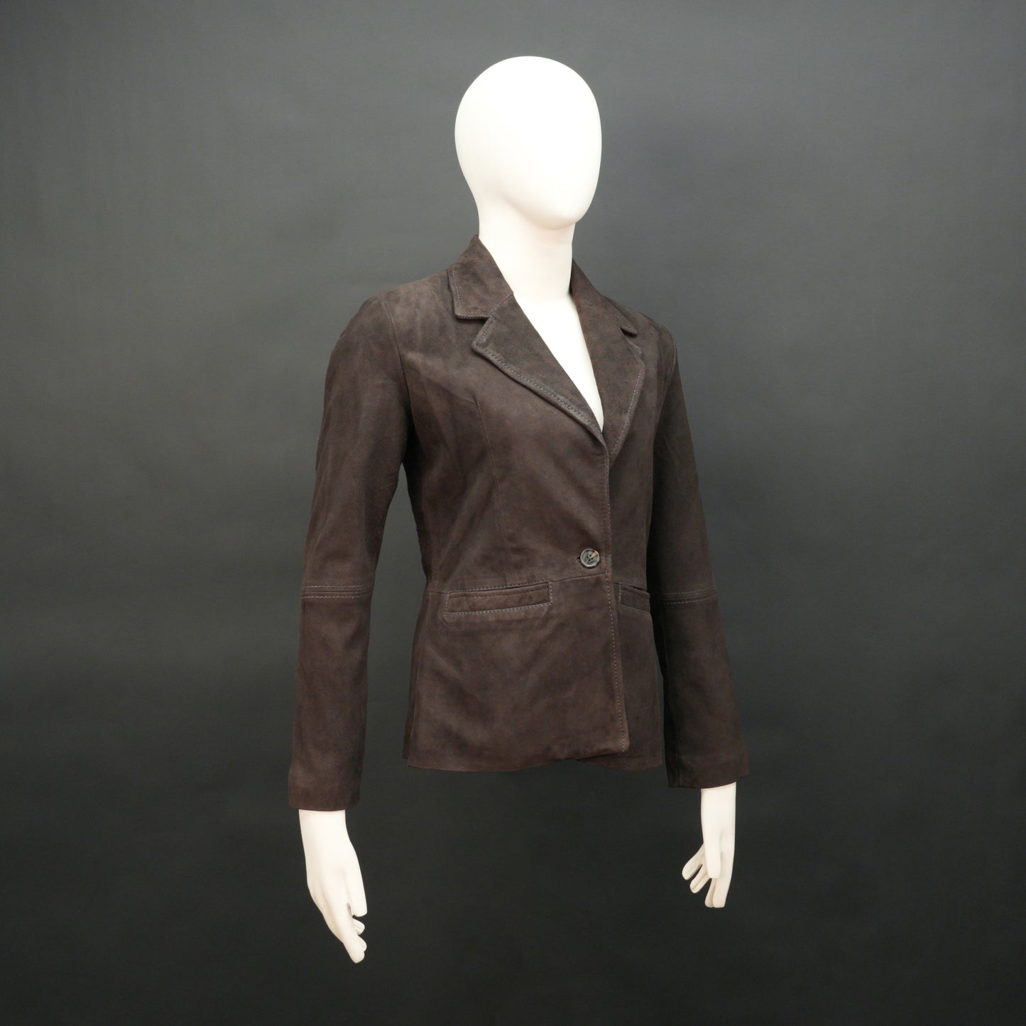 Dark brown goat leather coat with soft, durable material, two functional pockets, and versatile design for casual and formal wear