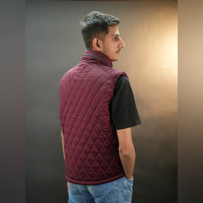 Maroon vest featuring a zip closure with snap button, two snap-button side pockets, and an inside pocket for secure, convenient storage