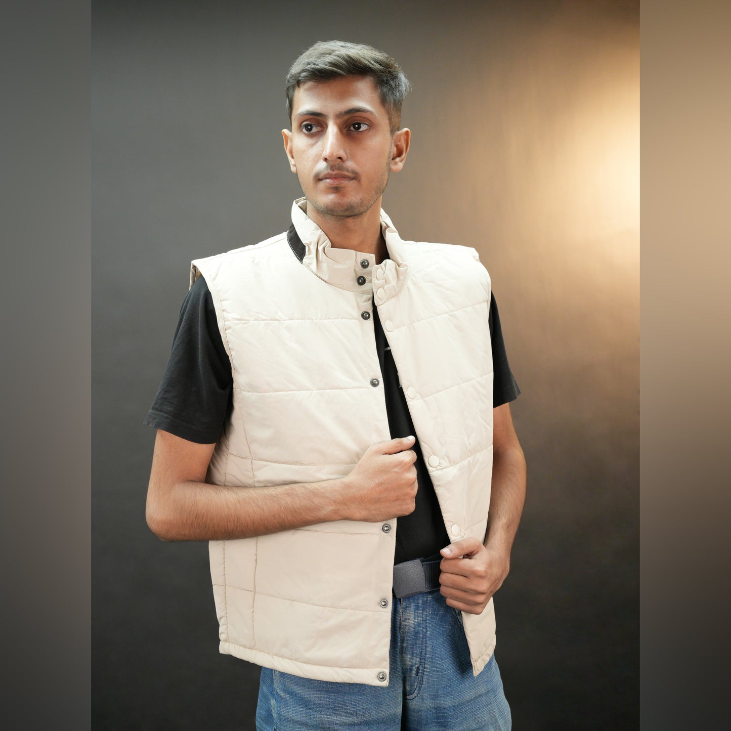 Beige jacket featuring a button closure, two snap-button side pockets, and one inner pocket for convenient, secure storage