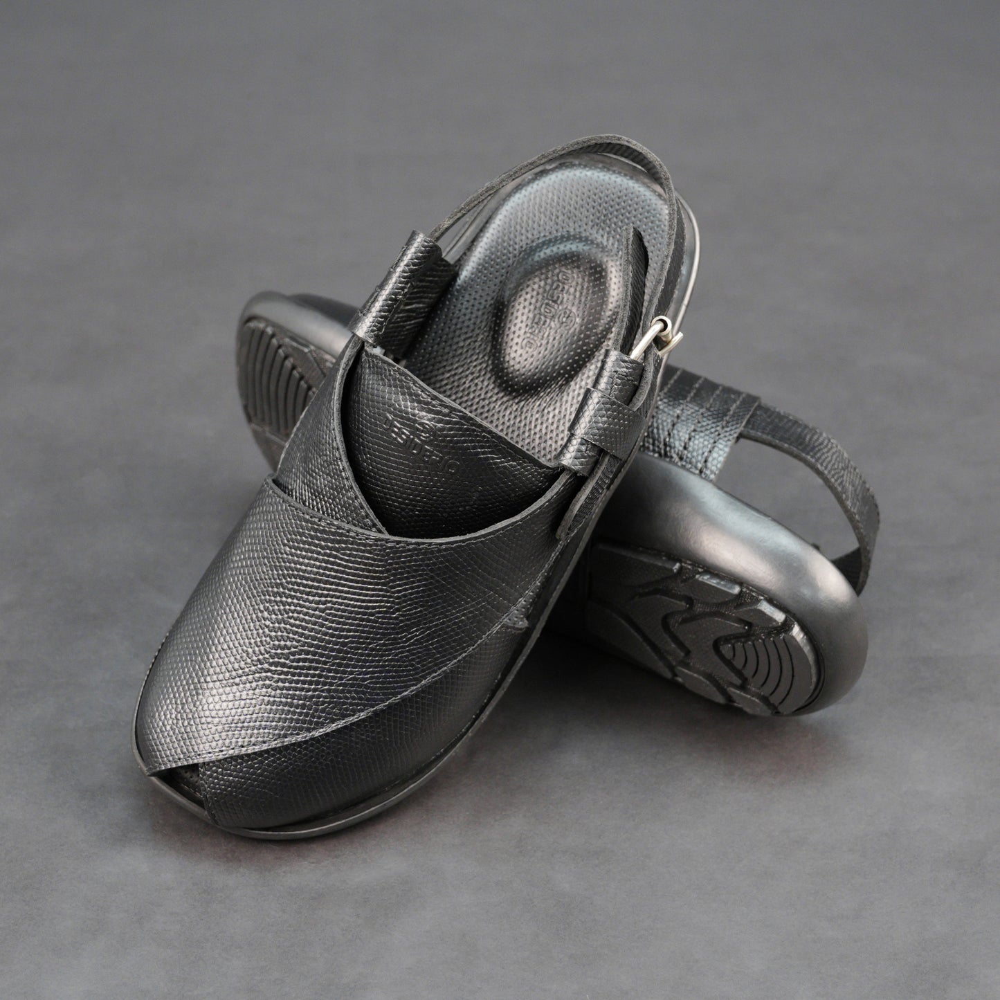 Black cow-printed W-Series leather shoe with goat leather lining, leather and EVA insole, and durable TPR sole.