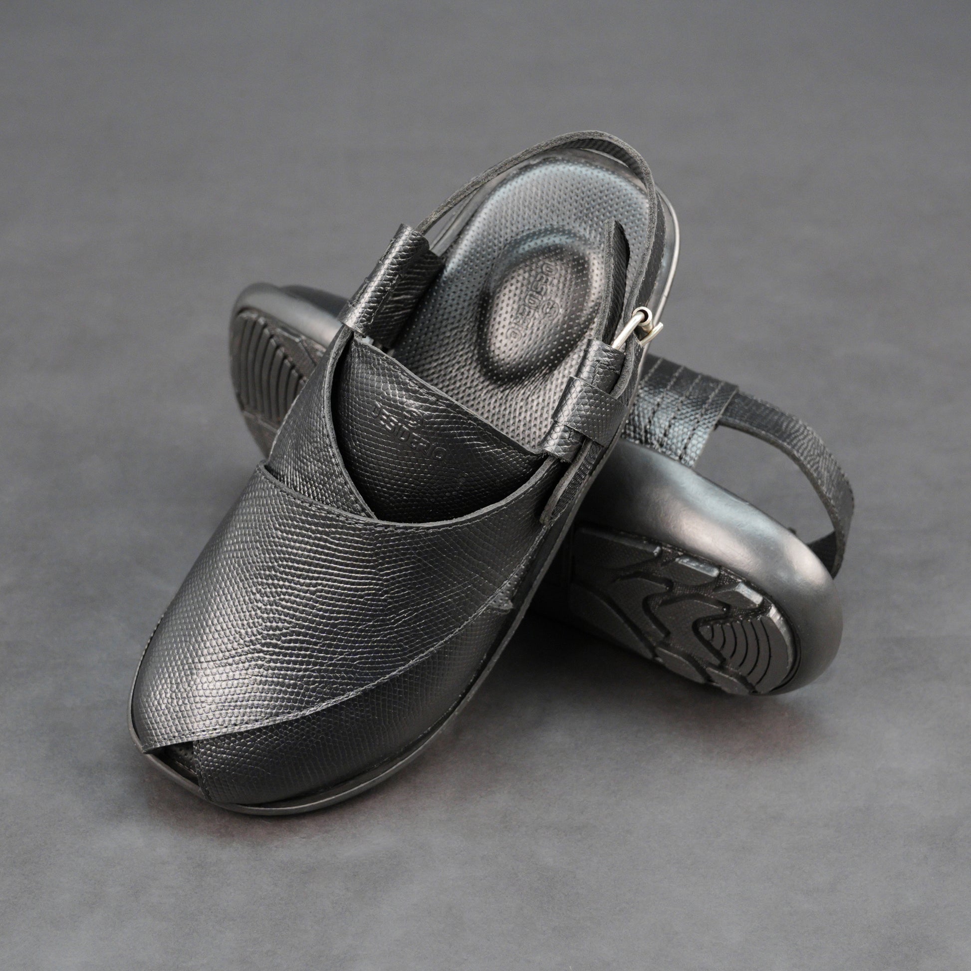 Black cow-printed W-Series leather shoe with goat leather lining, leather and EVA insole, and durable TPR sole.