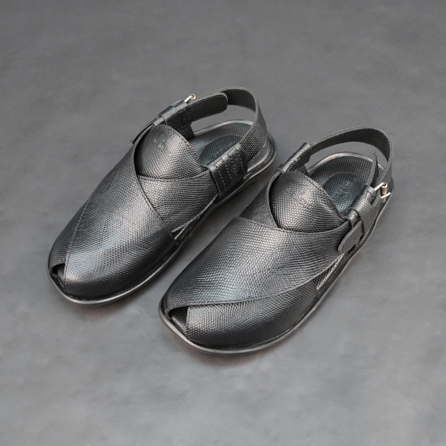 Black cow-printed W-Series leather shoe with goat leather lining, leather and EVA insole, and durable TPR sole.