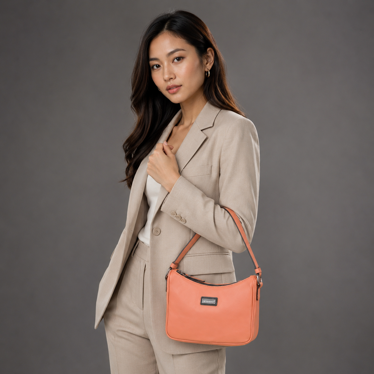 Coral sheep leather bag with zip closure and pockets.