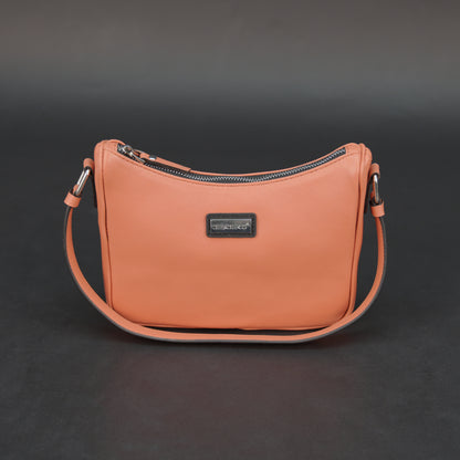 Coral sheep leather bag with zip closure and pockets.