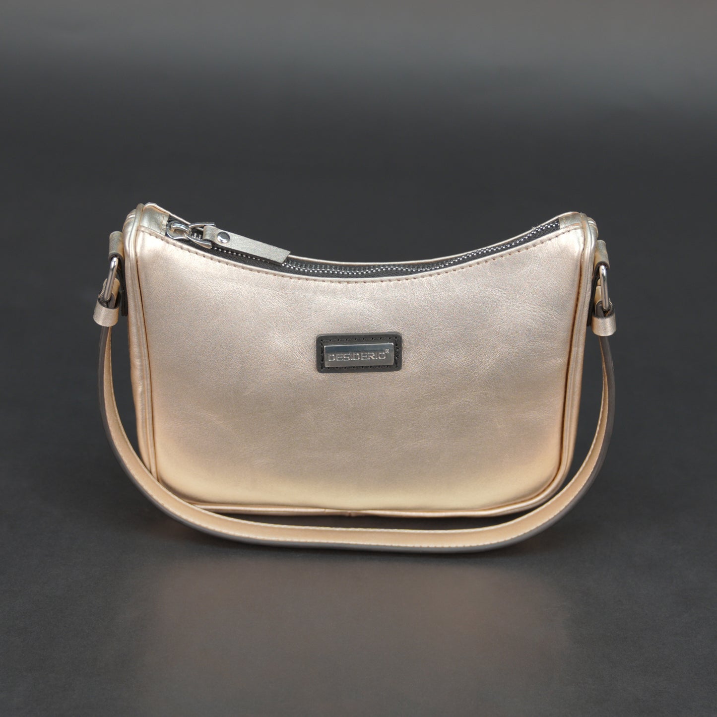 Metallic premium cow leather bag with zip closure, main compartment, and inner pocket for daily use.