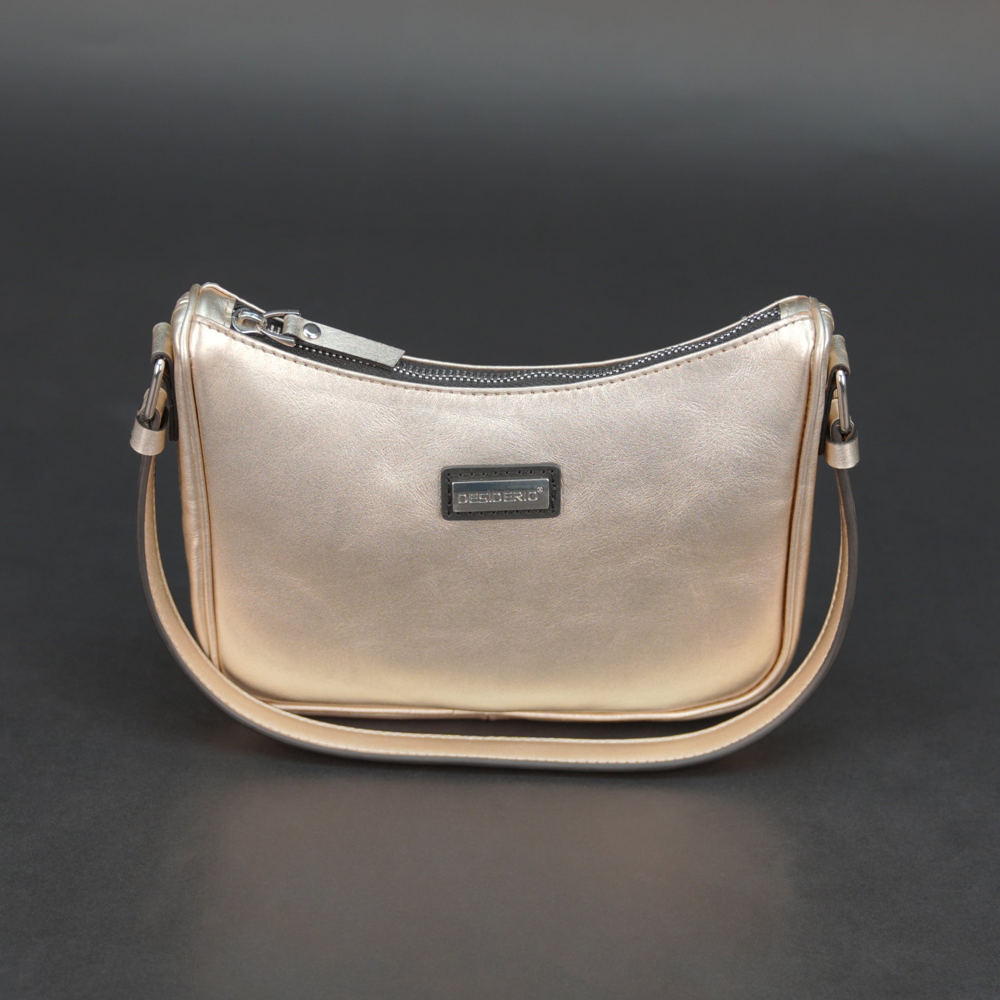 Metallic premium cow leather bag with zip closure, main compartment, and inner pocket for daily use.