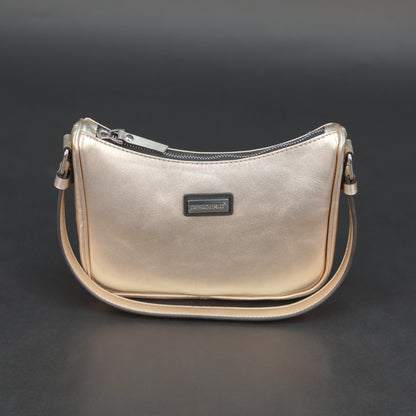 Metallic premium cow leather bag with zip closure, main compartment, and inner pocket for daily use.