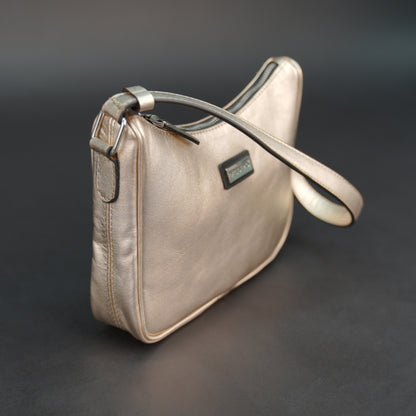 Metallic premium cow leather bag with zip closure, main compartment, and inner pocket for daily use.