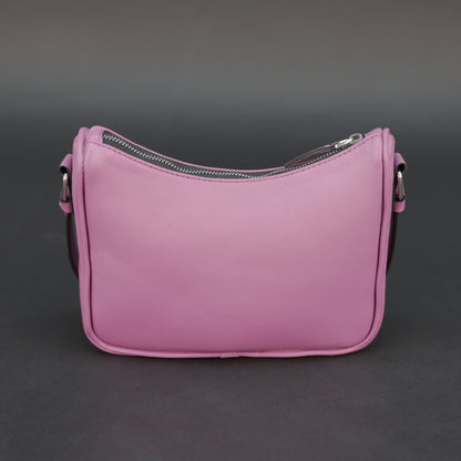 Pink sheep leather bag with zip closure and inner pocket.