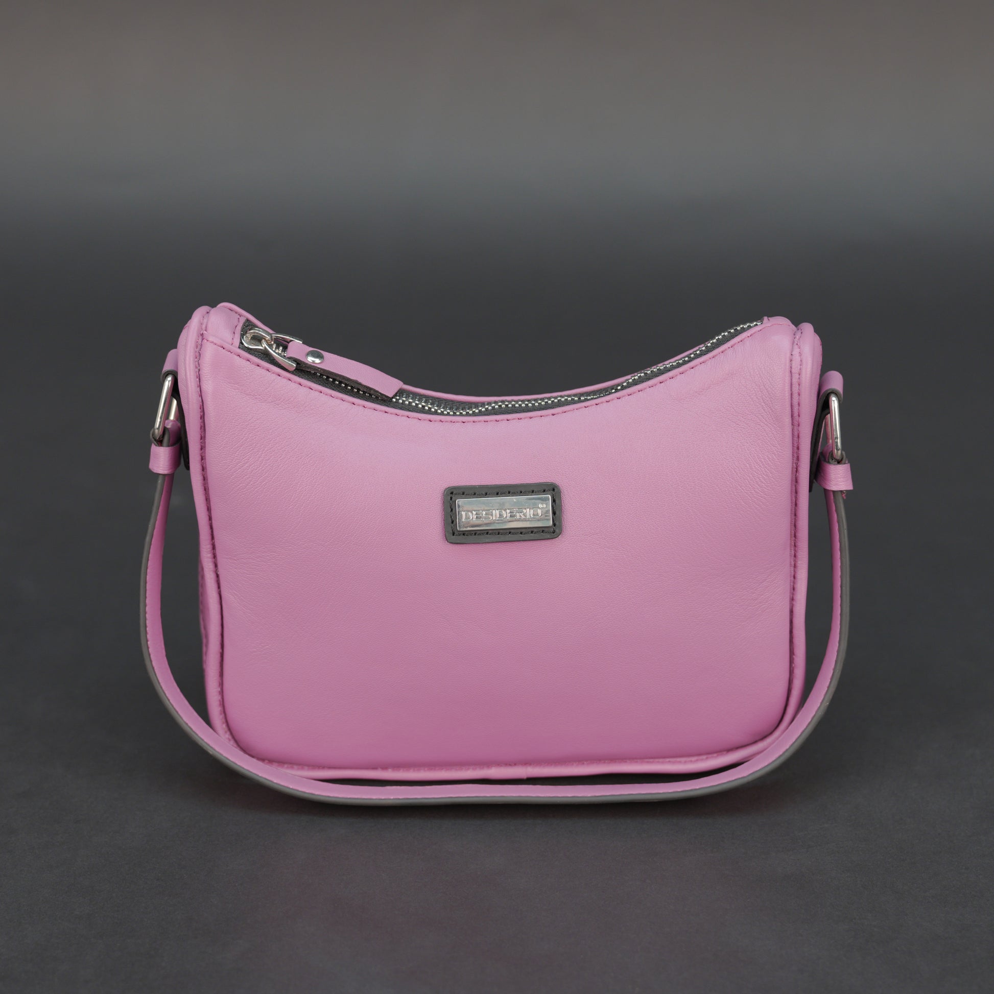 Pink sheep leather bag with zip closure and inner pocket.